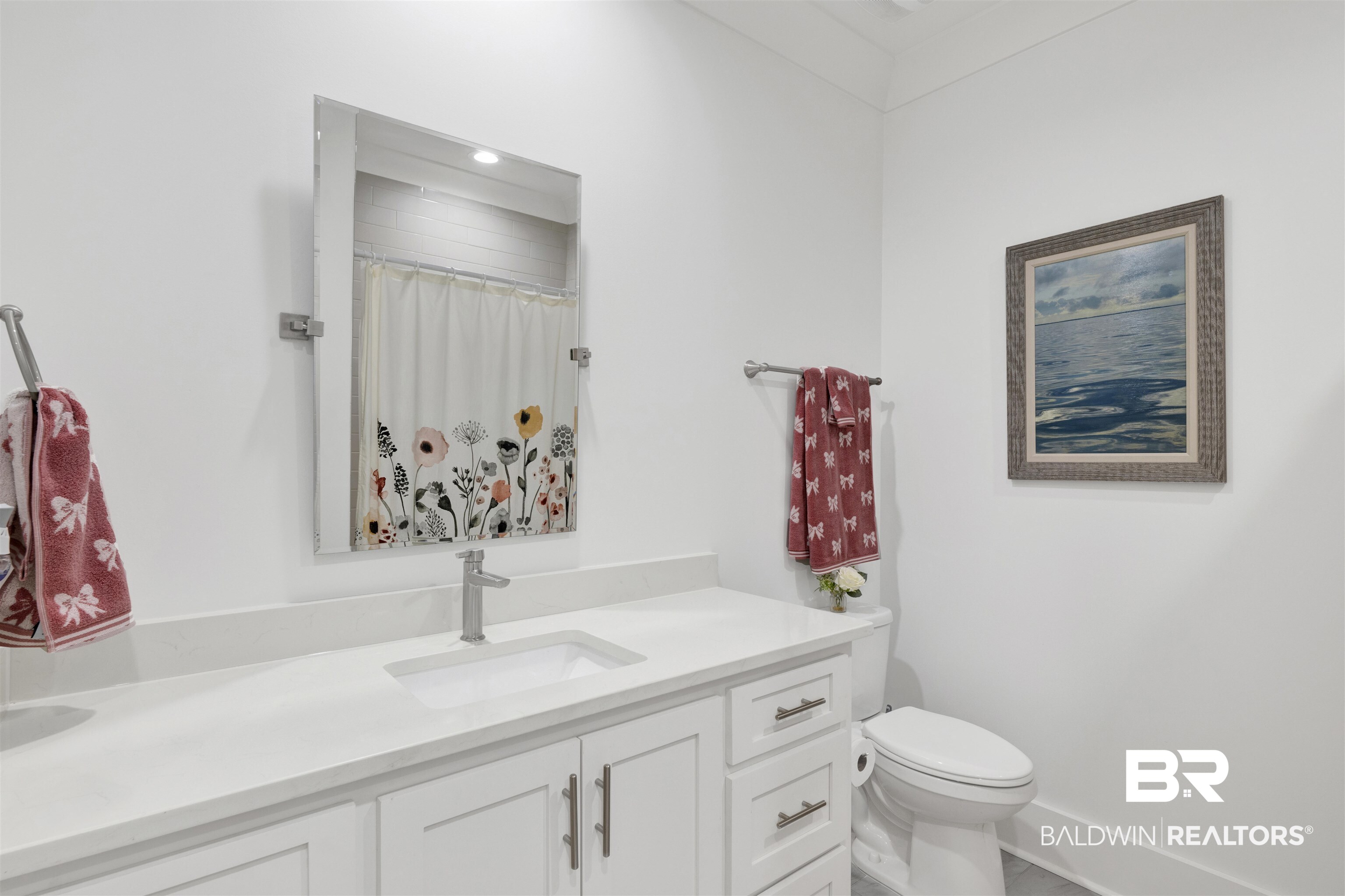 21702 Pillars Street Fairhope, AL 36532 - Photo 29 of 54 White vanity with integrated sink, quartz countertop, and brushed nickel faucet