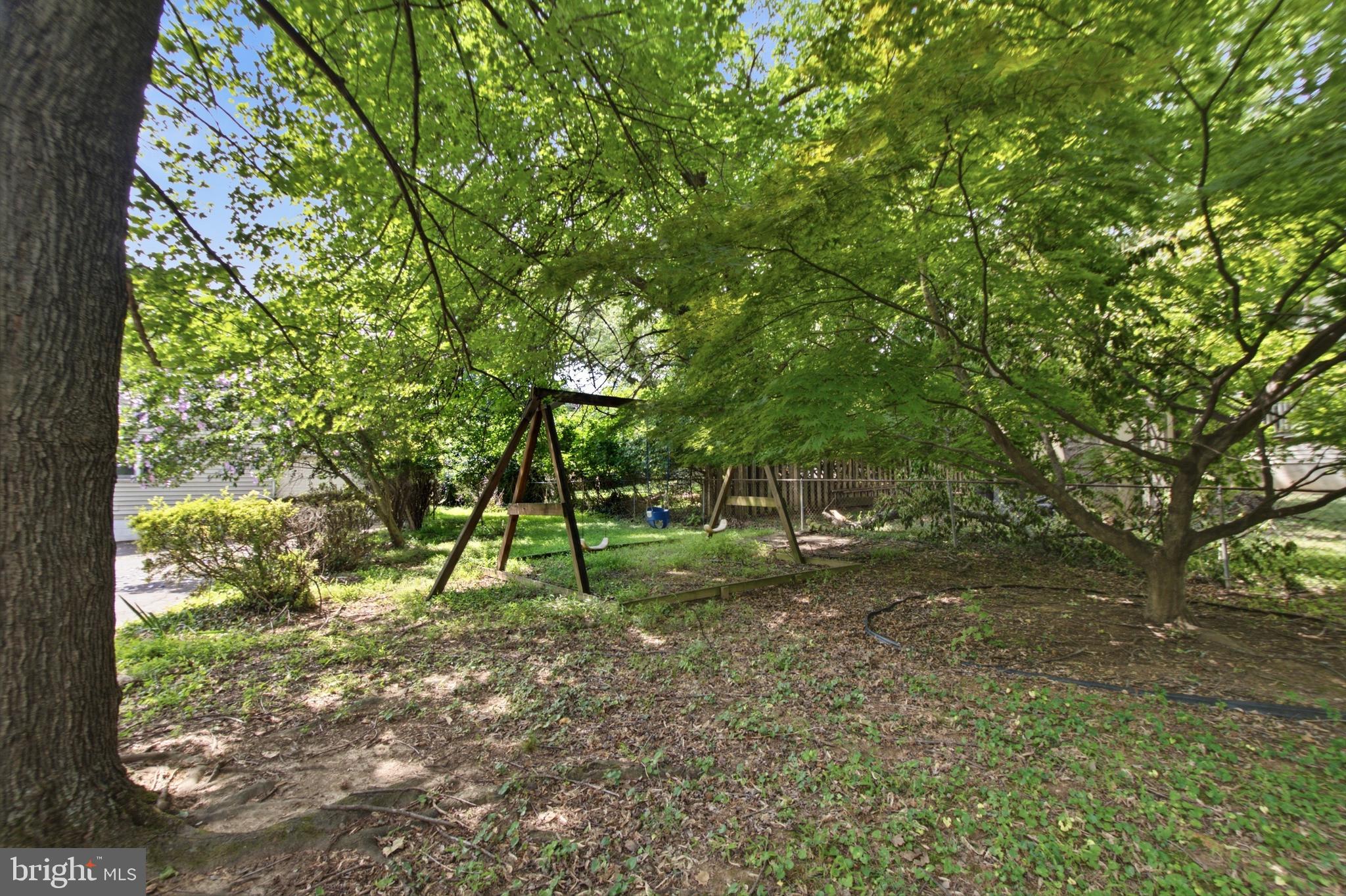 511 Malcolm Road Northwest Vienna, VA 22180 - Photo 14 of 16 a green field with lots of trees