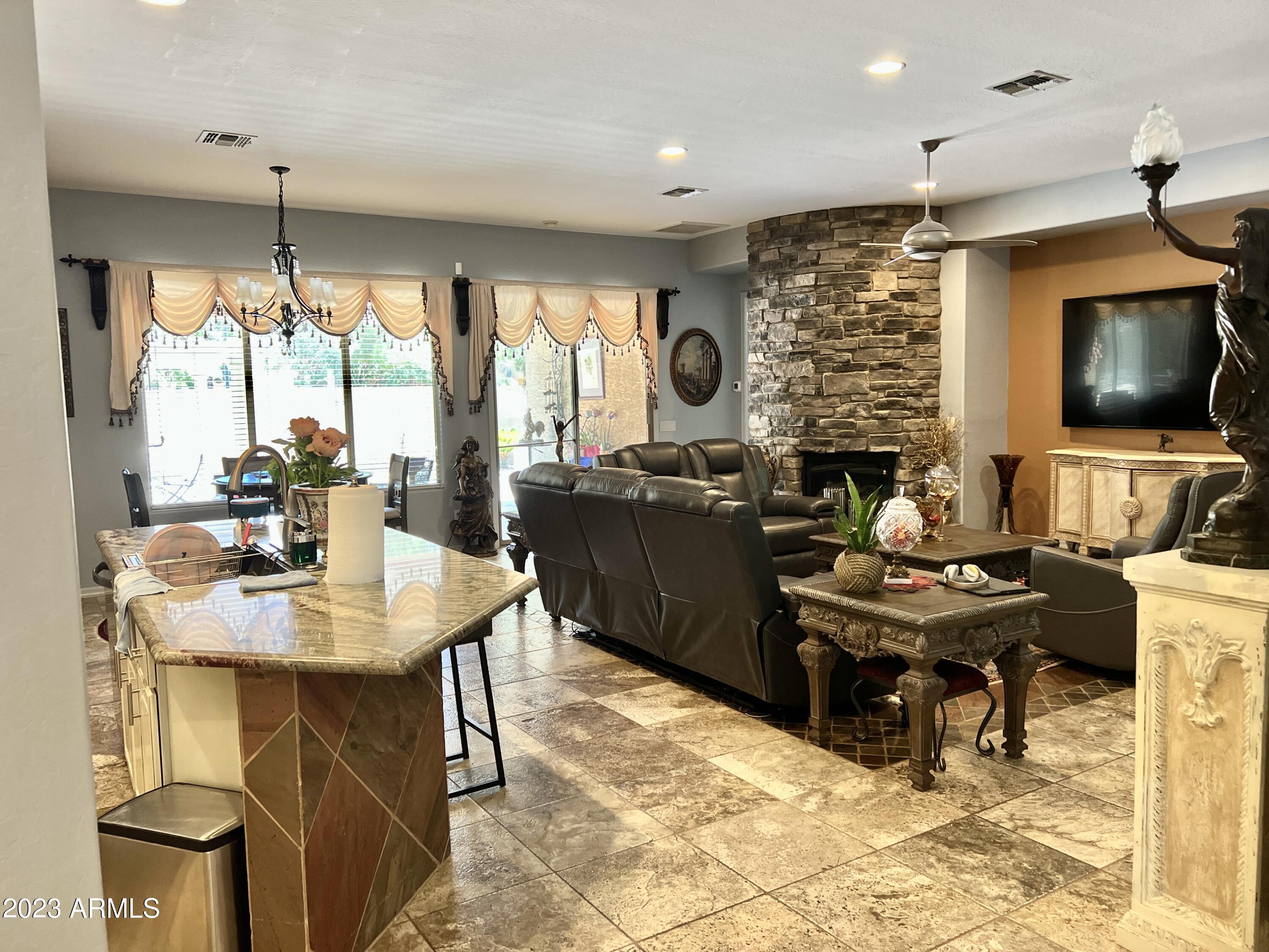4735 South Rim Road Gilbert, AZ 85297 - Photo 14 of 38 a view of a dining room with furniture window and outside view