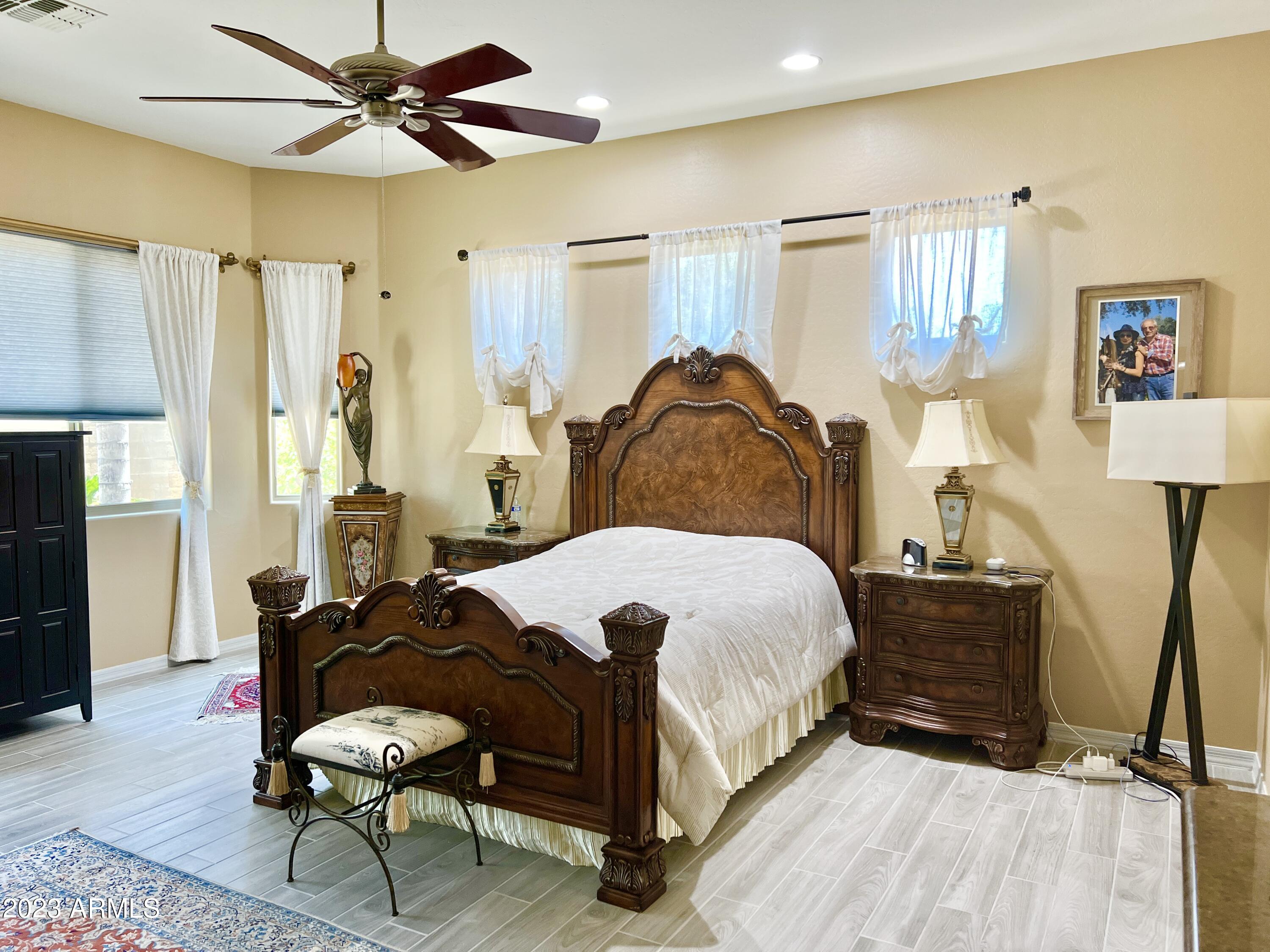 4735 South Rim Road Gilbert, AZ 85297 - Photo 21 of 38 a bedroom with a bed dresser and a window