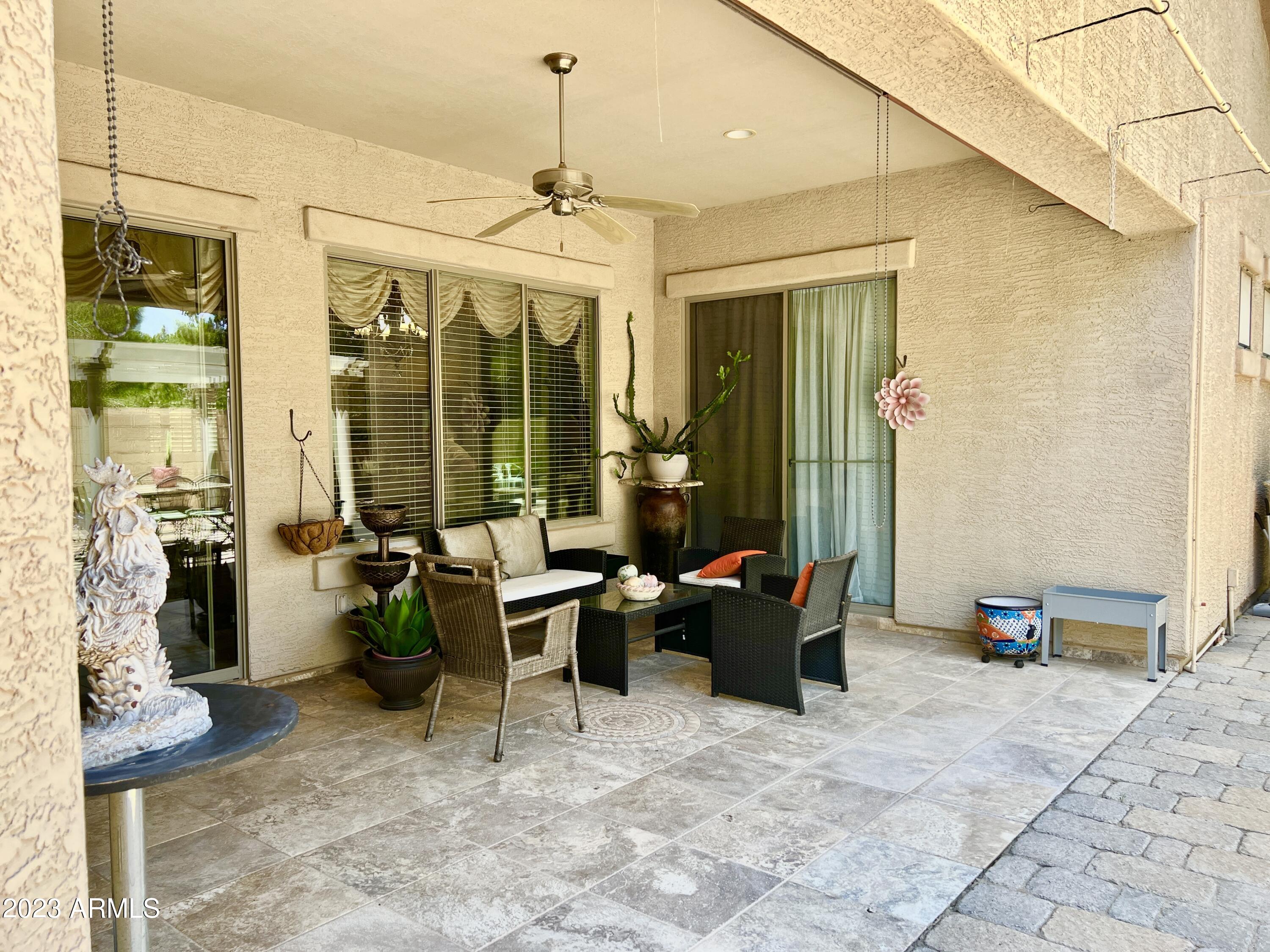 4735 South Rim Road Gilbert, AZ 85297 - Photo 31 of 38 a living room with patio furniture