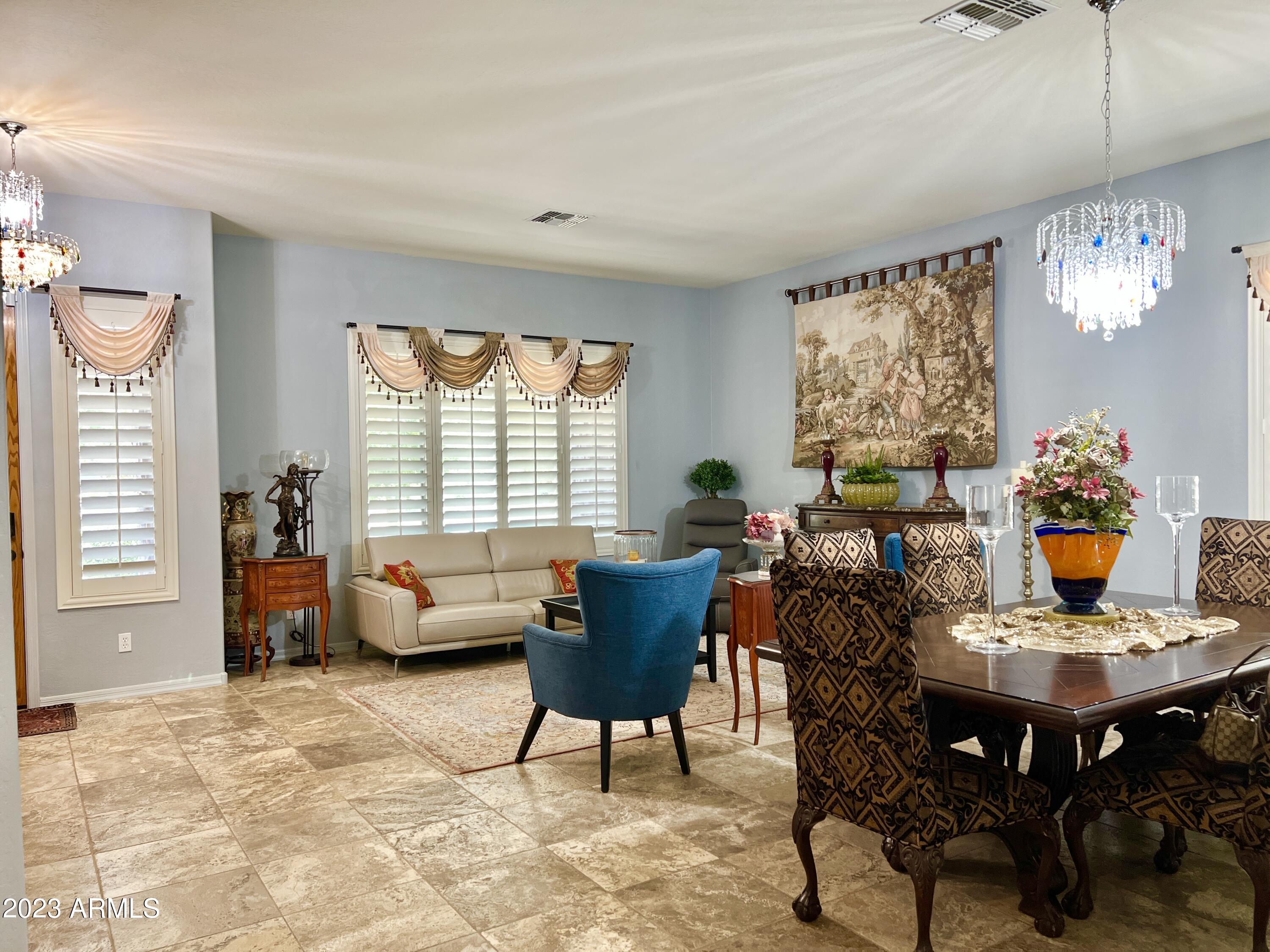 4735 South Rim Road Gilbert, AZ 85297 - Photo 8 of 38 a living room with furniture and a window