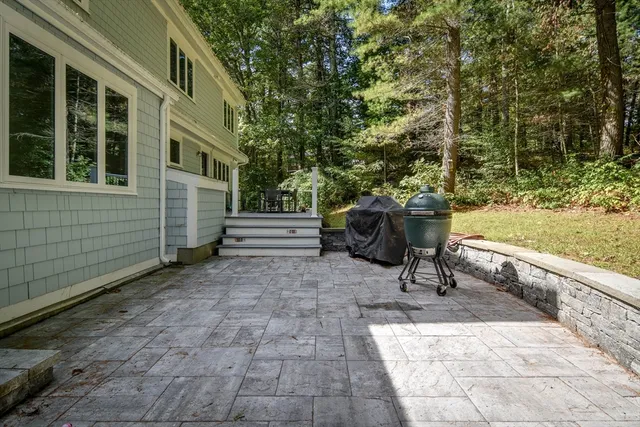 a view of a deck with table and chairs and wooden floor