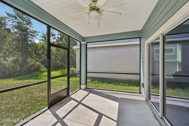 a view of a room with a large window