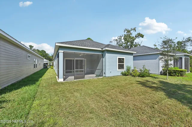 a view of an house with backyard space and garden