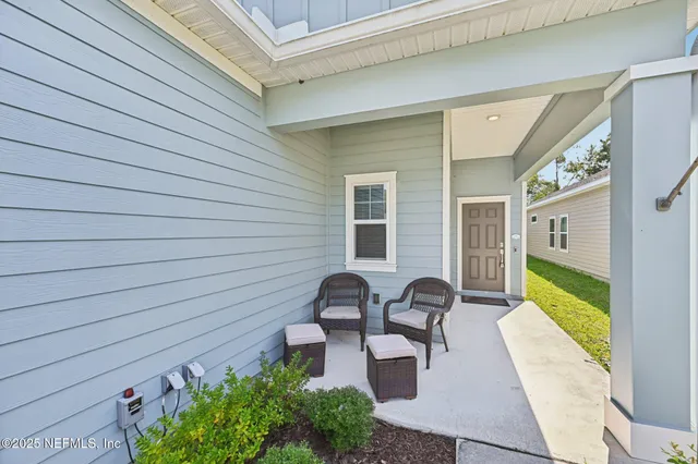 a view of backyard with seating space and garden