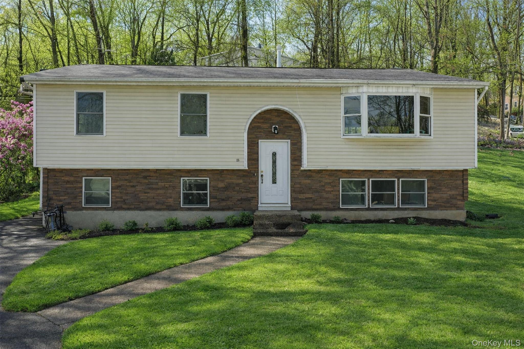 153 South Pascack Road Nanuet, NY 10954 - Photo 1 of 27 a front view of a house with a yard