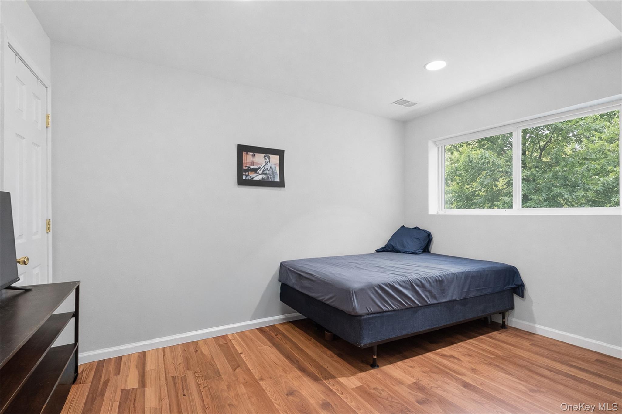 153 South Pascack Road Nanuet, NY 10954 - Photo 17 of 27 a bedroom with a bed and a window