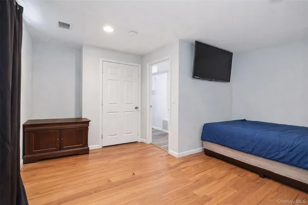 a living room with hard wood floors and a fireplace