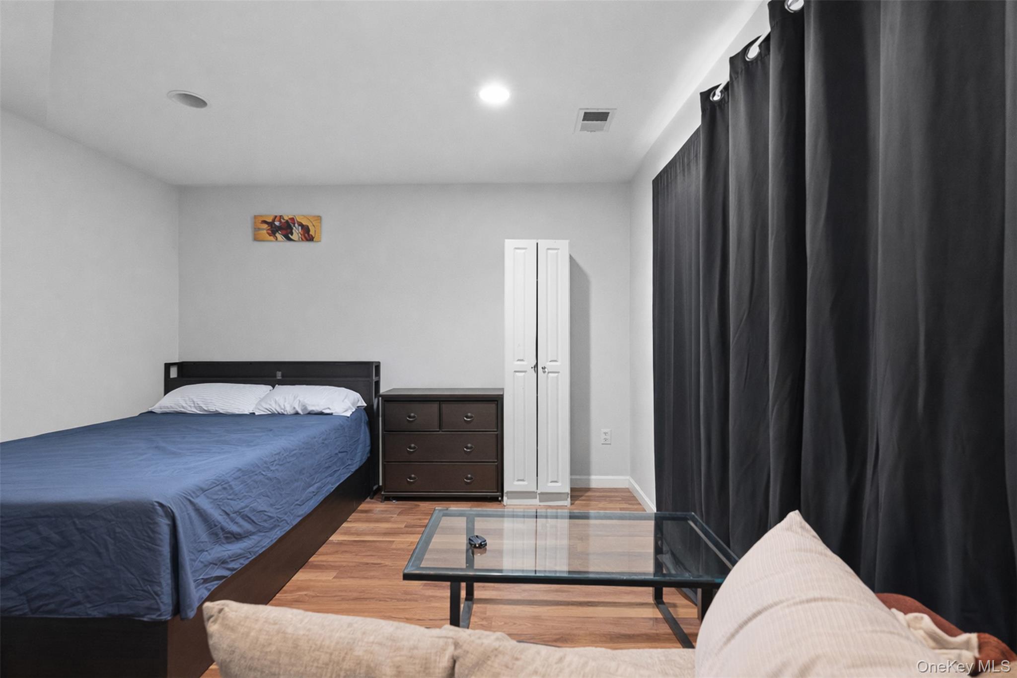 153 South Pascack Road Nanuet, NY 10954 - Photo 20 of 28 a bedroom with a bed and a window