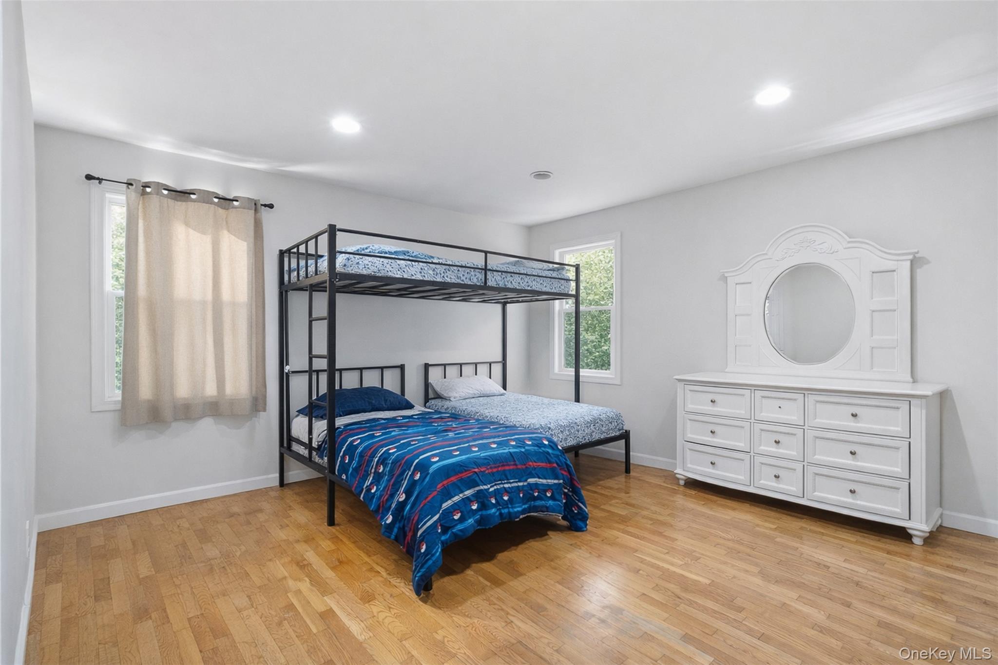 153 South Pascack Road Nanuet, NY 10954 - Photo 21 of 27 a bedroom with a bed and a dresser