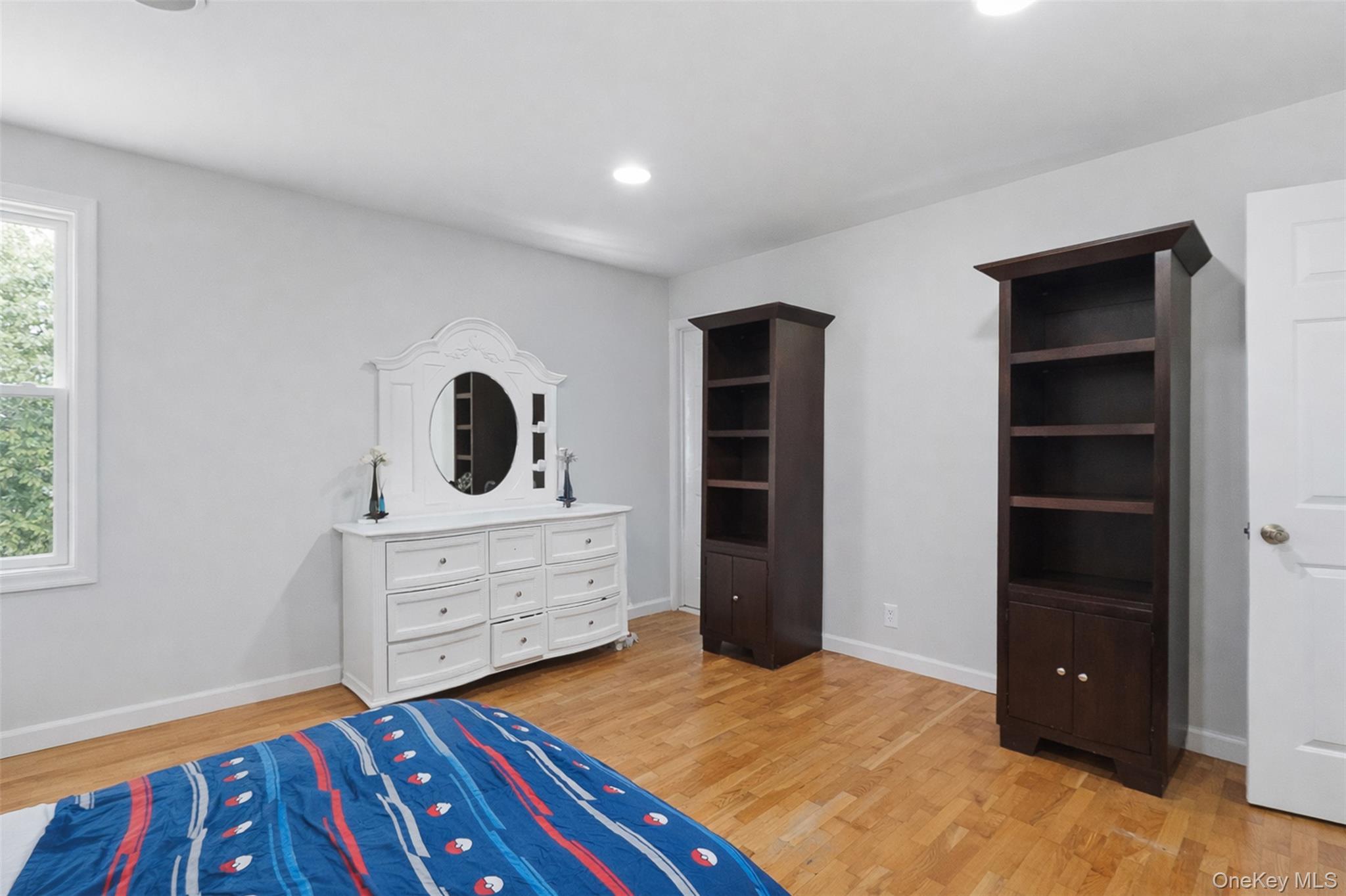 153 South Pascack Road Nanuet, NY 10954 - Photo 22 of 27 a bedroom with a bed and a dresser