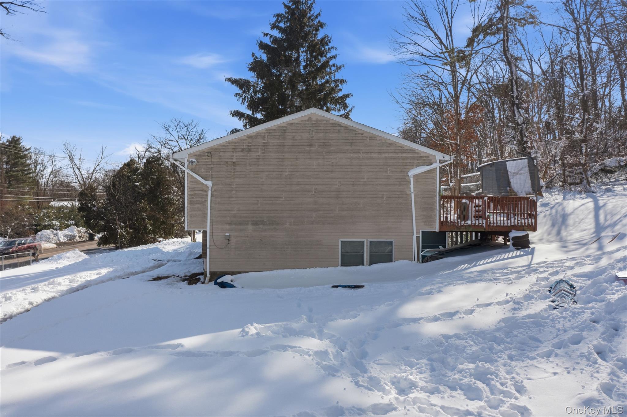 153 South Pascack Road Nanuet, NY 10954 - Photo 26 of 28 a brick house with a large tree in front of it