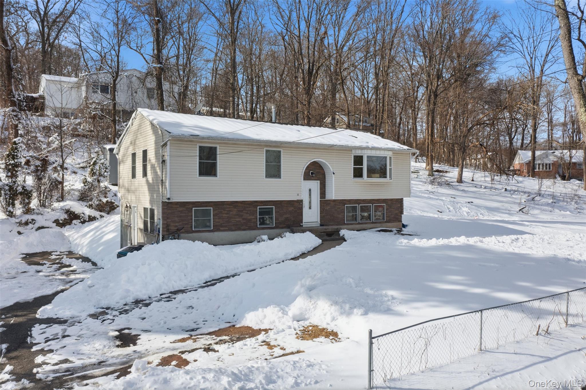 153 South Pascack Road Nanuet, NY 10954 - Photo 27 of 28 a front view of a house with a yard covered in snow
