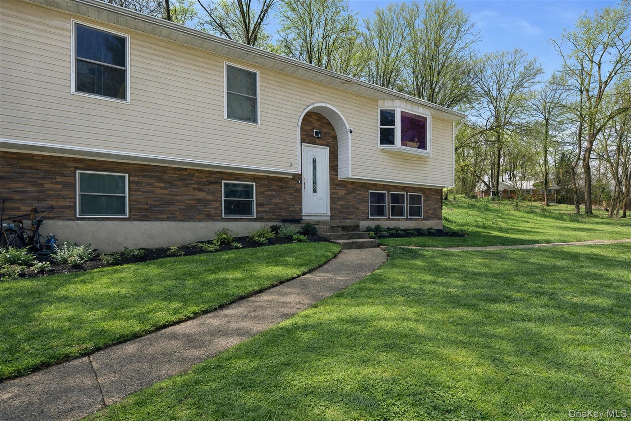 153 South Pascack Road Nanuet, NY 10954 - Photo 27 of 27 a front view of a house with garden