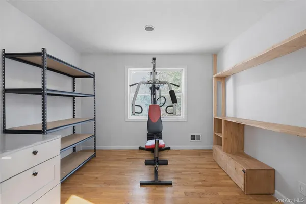 a room with furniture and wooden floors