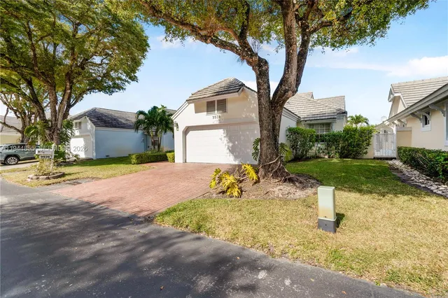 a view of a house with a yard