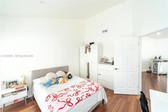 a bathroom with a sink mirror vanity and toilet