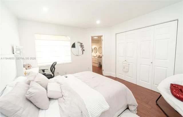 a view of a kitchen with a lot of stuff and cabinets