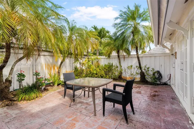 an aerial view of a house with a yard and garden