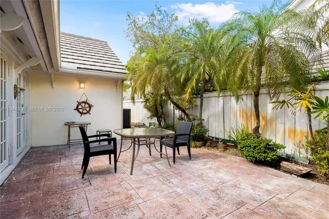 an aerial view of a house with a yard and garden