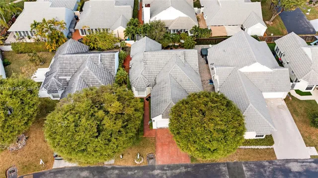 an aerial view of residential houses with swimming pool