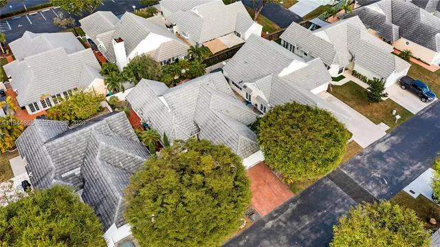 an aerial view of residential houses with outdoor space