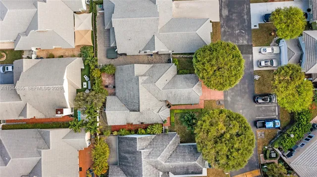 an aerial view of residential houses with outdoor space