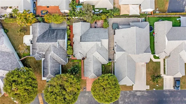 an aerial view of residential houses with outdoor space