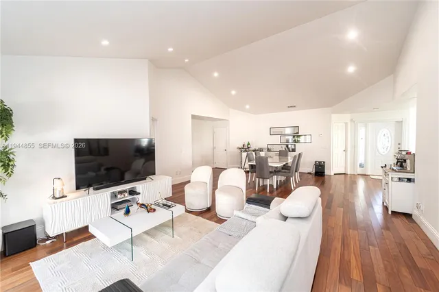 a living room with furniture and a flat screen tv
