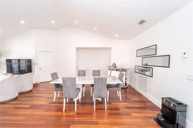 a view of kitchen with cabinets and wooden floor