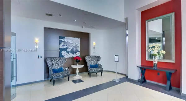 a living room with furniture and a window