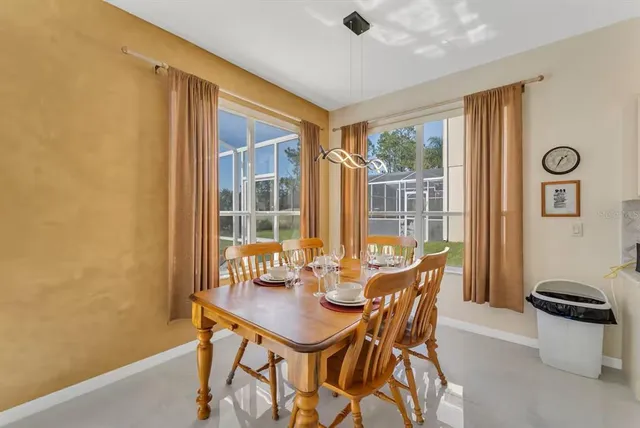 a bedroom with two beds and a chandelier