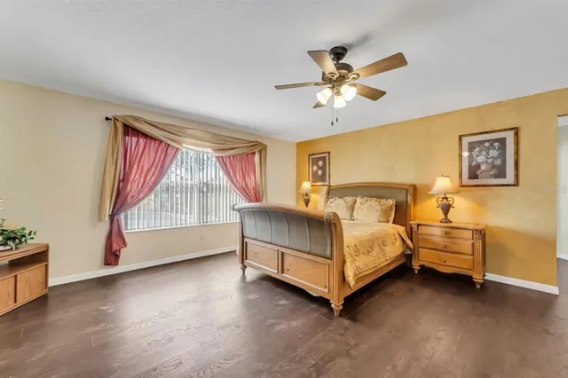 a bathroom with double vanity sink a toilet and a shower
