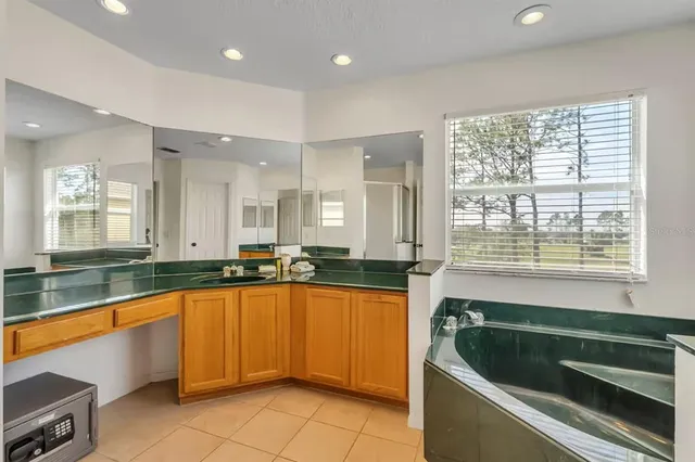 a bathroom with a sink a toilet and shower curtain