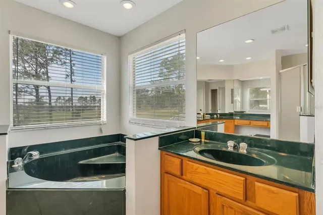 a bedroom with two beds and window