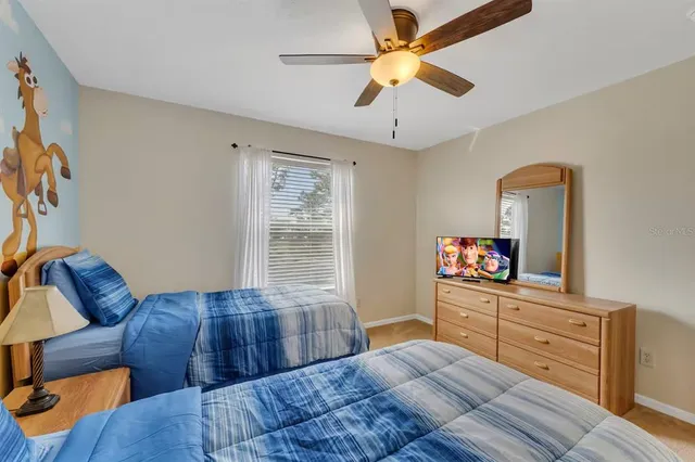 an aerial view of residential houses with outdoor space and swimming pool