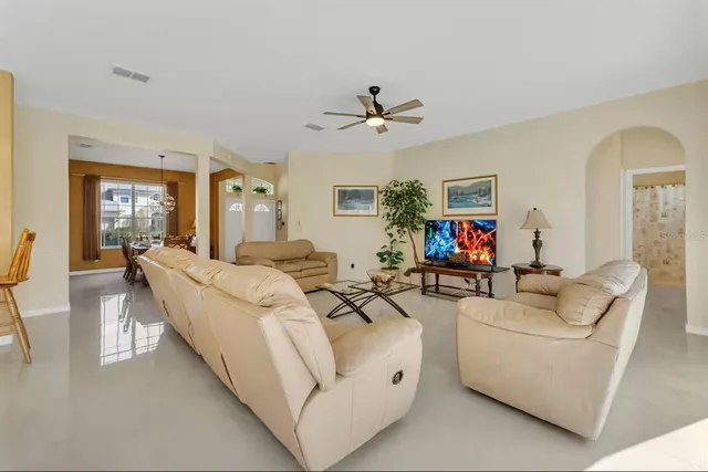 a large white kitchen with white cabinets and stainless steel appliances