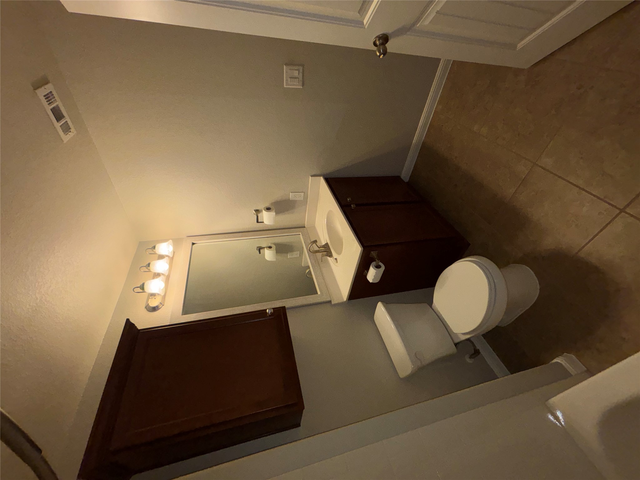 634 River Bluff Circle Georgetown, TX 78626 - Photo 19 of 37 Bathroom featuring vanity, dark tile patterned floors, and a tub