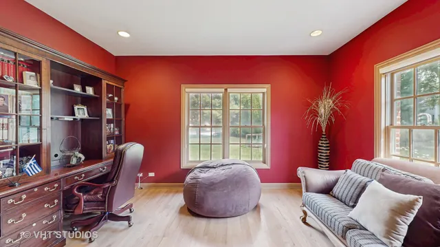 a view of a table and chairs under an umbrella