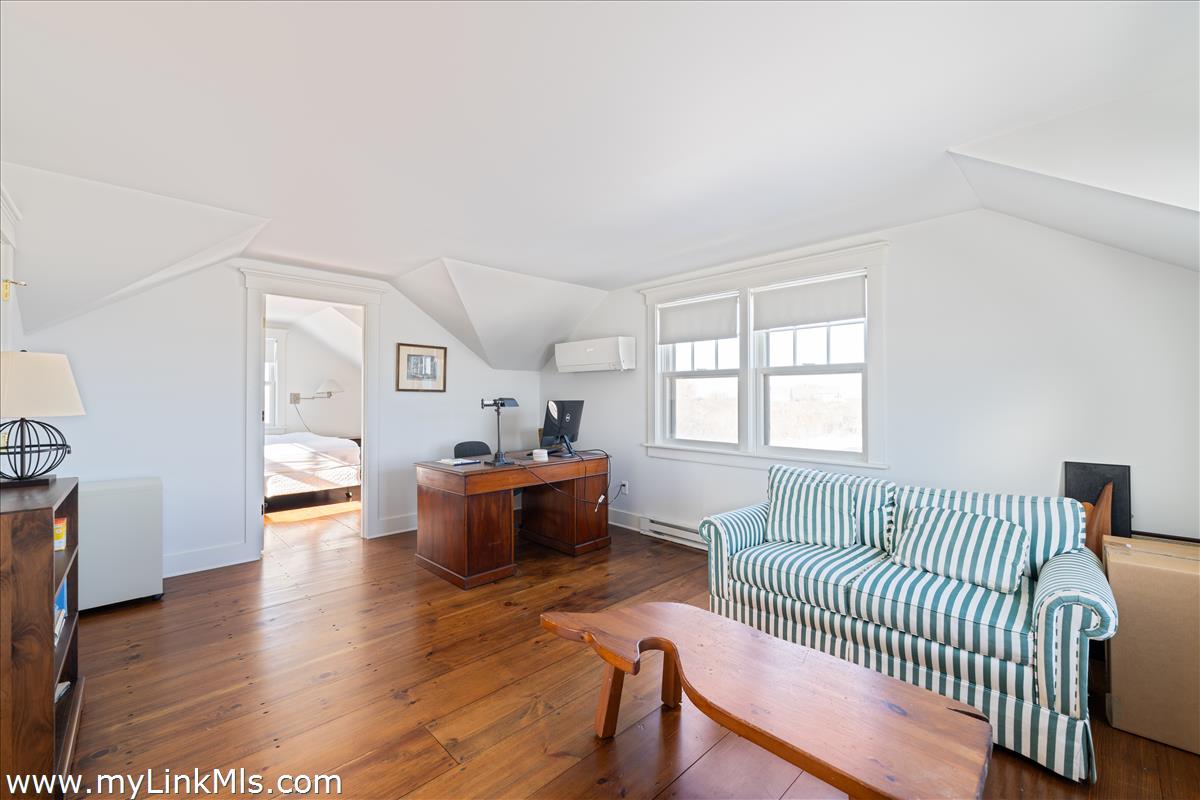 100 Baxter Road Nantucket, MA 02554 - Photo 7 of 11 a living room with furniture and a table