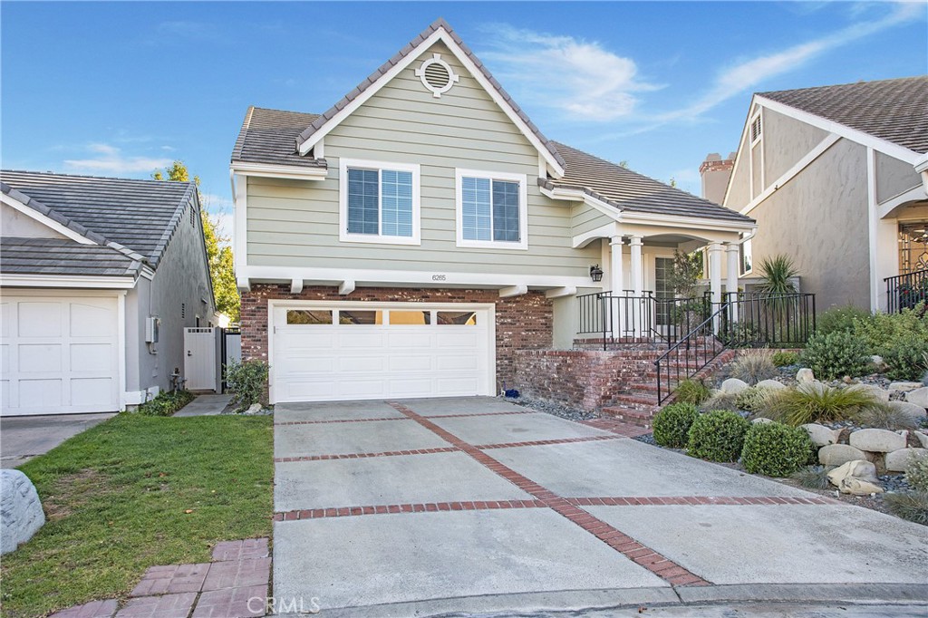 6265 Majorca Circle Long Beach, CA 90803 - Photo 1 of 38 a front view of a house with a yard and garage