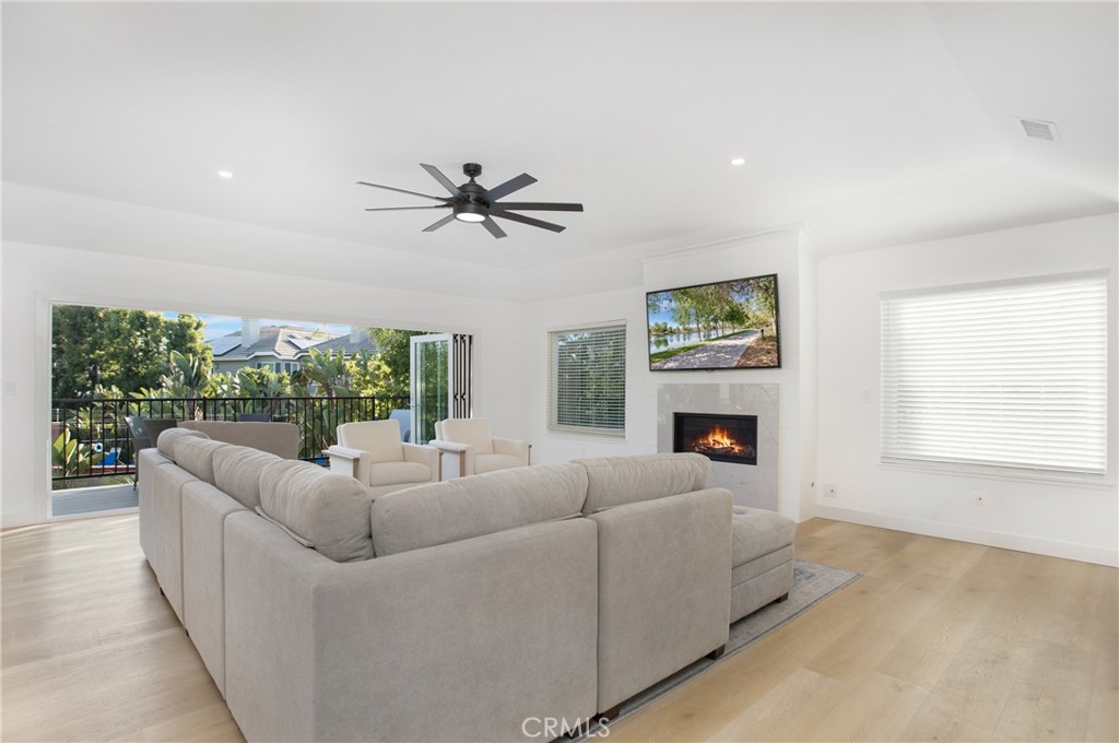 6265 Majorca Circle Long Beach, CA 90803 - Photo 12 of 38 a living room with furniture large window and a fireplace