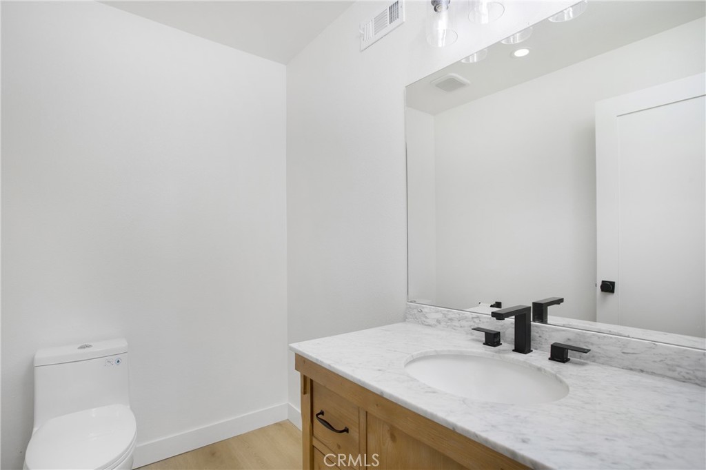 6265 Majorca Circle Long Beach, CA 90803 - Photo 13 of 38 a bathroom with a sink vanity and toilet