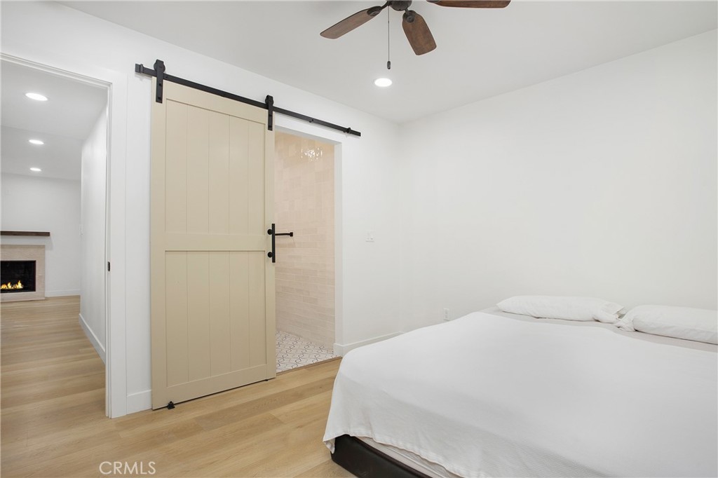6265 Majorca Circle Long Beach, CA 90803 - Photo 24 of 38 a bedroom with a bed and a ceiling fan