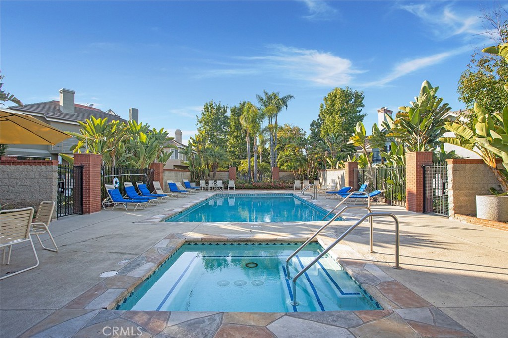 6265 Majorca Circle Long Beach, CA 90803 - Photo 36 of 38 a view of a swimming pool with a lounge chairs