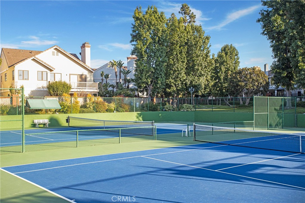 6265 Majorca Circle Long Beach, CA 90803 - Photo 38 of 38 a view of swimming pool with lawn chairs and large trees