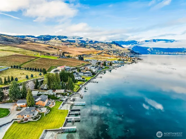a view of swimming pool with outdoor seating and city view