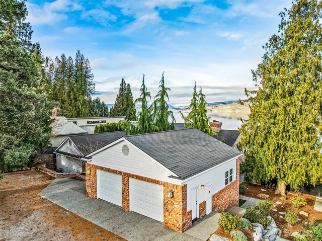 a view of a lake with couches and city view