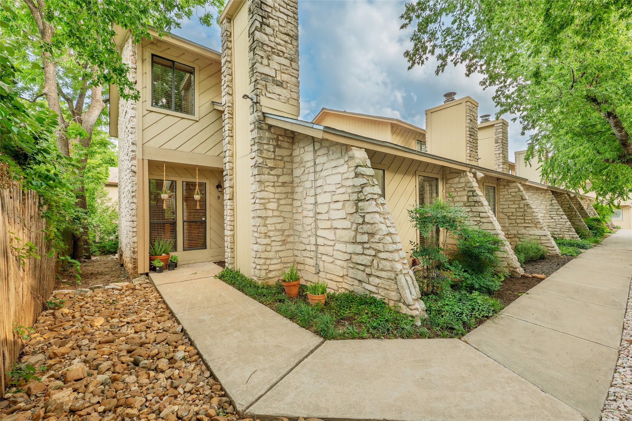 2500 Enfield Road, Unit 9 Austin, TX 78703 - Photo 1 of 26 Distinctive limestone accents frame the entrance to this Tarrytown gem, offering a perfect blend of mid-century character and central Austin convenience.